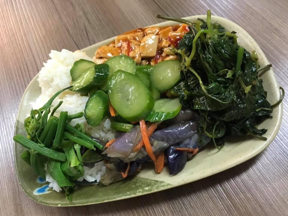 Stemming Stuffed Eggplant and Braised Tofu at a pay by weight vegan and vegetarian buffet in Taipei 